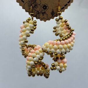 Orange, yellow and gold beaded spiral earrings.